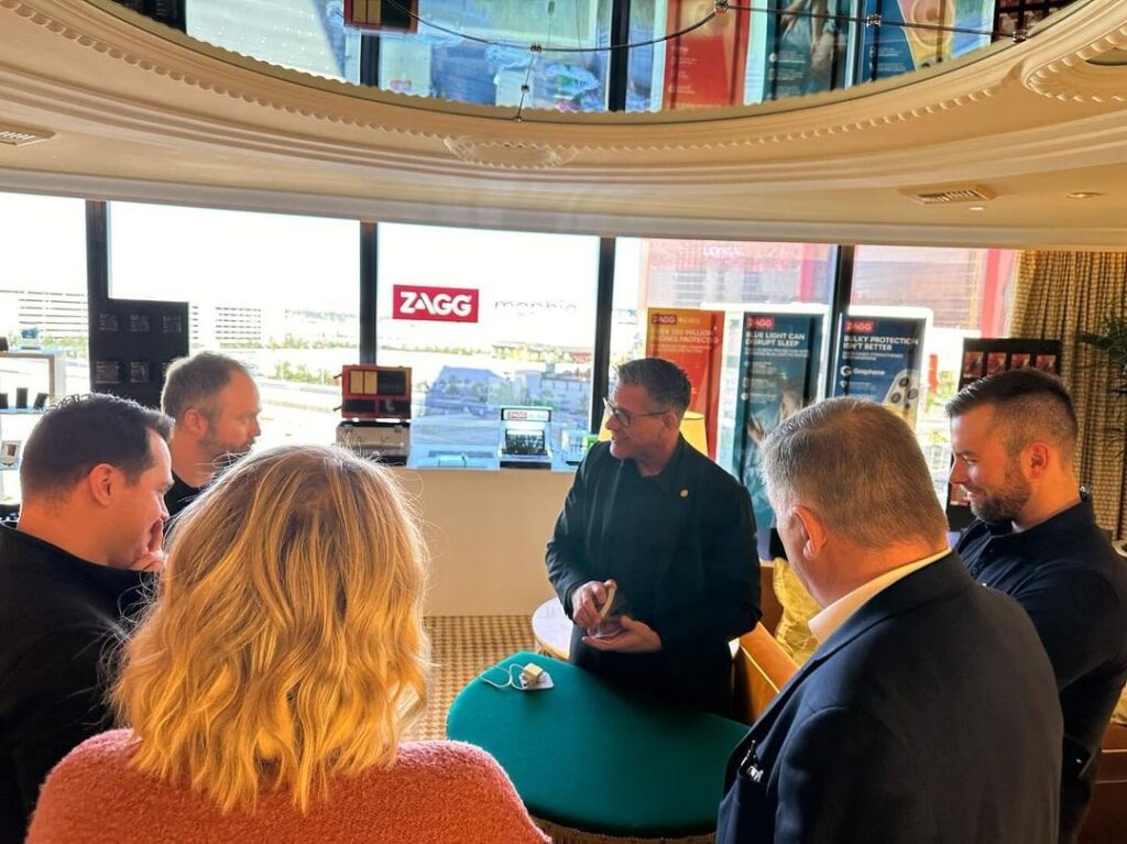 Stationary close-up magician performing for a group at a corporate event