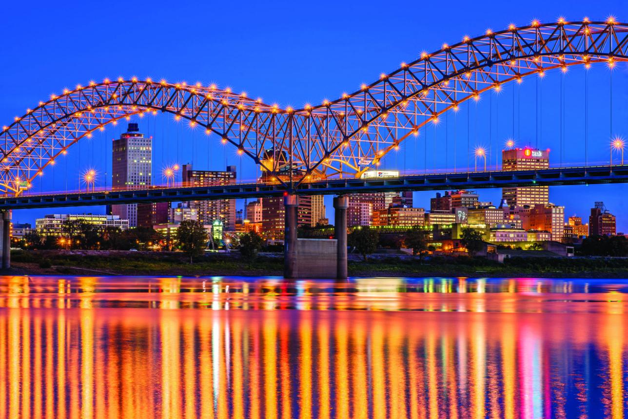 Memphis Tennessee Skyline Memphis skyline with Mississippi River and bridge at sunset
