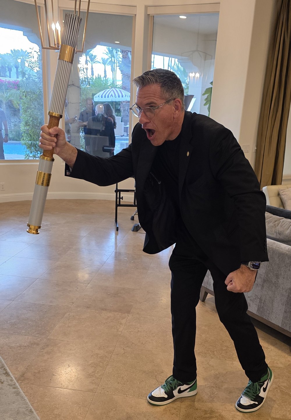 magician-zach-waldman-olympic-torch-rancho-mirage Magician Zach Waldman holding an Olympic torch at a private party in Rancho Mirage